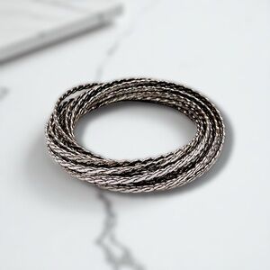 Stylish Statement Set of 12 Intertwined Silver Tone Bangle Bracelets